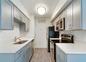 Thumbnail 2 of 19 - the preserve at ballantyne commons apartment kitchen with stainless steel appliances