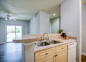 Thumbnail 23 of 29 - a kitchen with a sink and a counter top