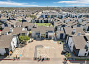Thumbnail 40 of 40 - A residential area with houses and a basketball court.