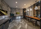 Thumbnail 17 of 30 - a bar with stools and a counter with a wood countertop