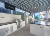 Thumbnail 13 of 22 - Outdoor kitchen with grill and sink