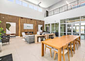 Thumbnail 3 of 31 - A conference room with a long table and chairs.