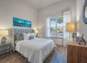 Thumbnail 5 of 22 - a bedroom with a large bed and a window