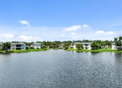 Thumbnail 2 of 41 - the view of a lake with houses on the side of it