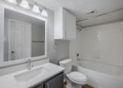Thumbnail 28 of 29 - a bathroom with a sink toilet and bathtub