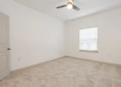 Thumbnail 12 of 41 - an empty room with a ceiling fan and a window