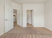 Thumbnail 11 of 30 - A room with carpeted floor and white walls.