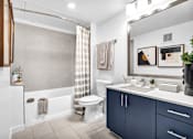 Thumbnail 16 of 33 - a bathroom with a toilet and a sink in it