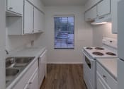 Thumbnail 9 of 19 - a kitchen with with appliances and white cabinets