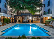 Thumbnail 29 of 37 - a swimming pool in the middle of an apartment building