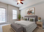 Thumbnail 5 of 42 - an empty bedroom with a bed and a ceiling fan