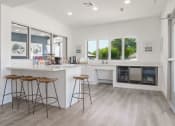 Thumbnail 11 of 29 - a kitchen with a counter and stools