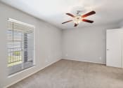 Thumbnail 15 of 34 - the living room of a house with a ceiling fan