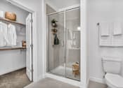Thumbnail 17 of 33 - a white bathroom with a walk in shower
