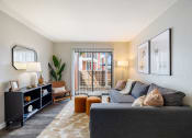 Thumbnail 1 of 20 - our apartments offer a living room with a couch and a tv