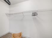 Thumbnail 24 of 37 - the living room of a studio apartment with white walls and a white closet with a