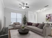 Thumbnail 6 of 32 - a living room with a couch and a coffee table