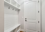 Thumbnail 9 of 38 - A white door is closed with a black handle.