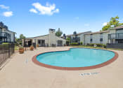 Thumbnail 23 of 34 - the preserve at ballantyne commons community swimming pool with apartment buildings