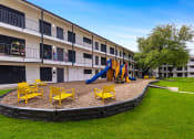 Thumbnail 10 of 17 - this is a photo of the playground in the leasing office at preston hollow apartments in d