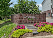 Thumbnail 16 of 17 - A brick wall with the words "Woodbine Park" on it.
