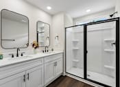 Thumbnail 48 of 56 - A bathroom with a white sink and a mirror above it.
