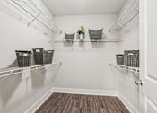 Thumbnail 34 of 38 - A white pantry with shelves and baskets.