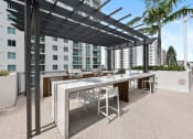 Thumbnail 26 of 66 - a terrace with a table and chairs and a pergola