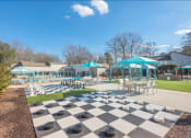 Thumbnail 7 of 14 - a giant chess board in the middle of a park