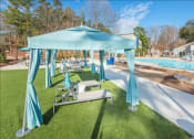 Thumbnail 5 of 14 - a blue canopy sitting on top of a lush green field