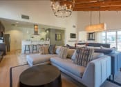 Thumbnail 2 of 14 - a living room with a couch and a table