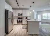 Thumbnail 23 of 65 - the preserve at ballantyne commons apartment kitchen with stainless steel appliances