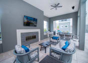 Thumbnail 11 of 33 - a living room with couches and chairs and a fireplace