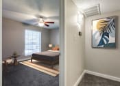 Thumbnail 9 of 20 - an open bedroom with a bed and a ceiling fan