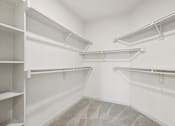 Thumbnail 33 of 57 - Empty white shelves in a room.