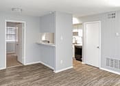 Thumbnail 13 of 19 - A kitchen area with a counter and cabinets.