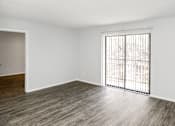 Thumbnail 16 of 19 - A room with a window and a sliding door.