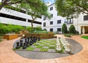 Thumbnail 19 of 37 - a large chess board in the courtyard of an apartment building
