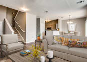Thumbnail 1 of 39 - a living room with a couch and a chair