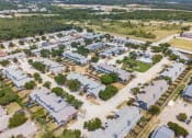 Thumbnail 38 of 39 - an aerial view of a neighborhood with houses and trees