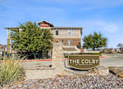 Thumbnail 24 of 24 - The Colby at Castle Hills is a modern building with a stone entrance.