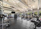 Thumbnail 23 of 35 - A spacious gym with a variety of exercise equipment.