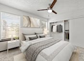 Thumbnail 6 of 18 - A bedroom with a large bed and a ceiling fan.