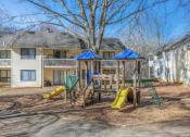 Thumbnail 9 of 16 - a playground in a yard in front of a house