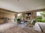 Thumbnail 13 of 17 - a resident clubhouse with a fire place and lounge chairs