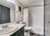 Thumbnail 25 of 40 - a bathroom with a shower toilet and sink
