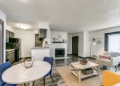 Thumbnail 18 of 40 - an open living room and kitchen with a table and chairs
