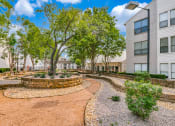 Thumbnail 35 of 40 - a courtyard between two buildings with trees and plants