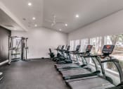 Thumbnail 27 of 40 - the gym has cardio machines and treadmills and large windows