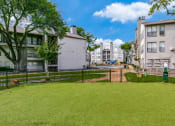 Thumbnail 31 of 40 - the yard is fenced in with a green lawn and a pool